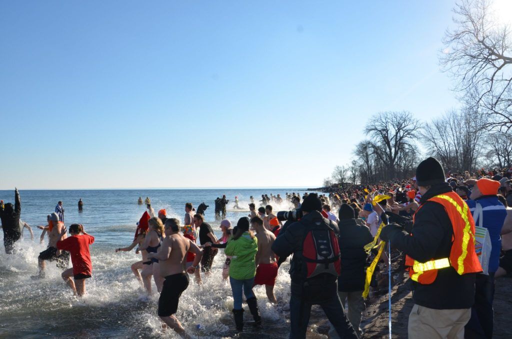Participants running into water for the Courage Polar Bear Dip for World Vision.