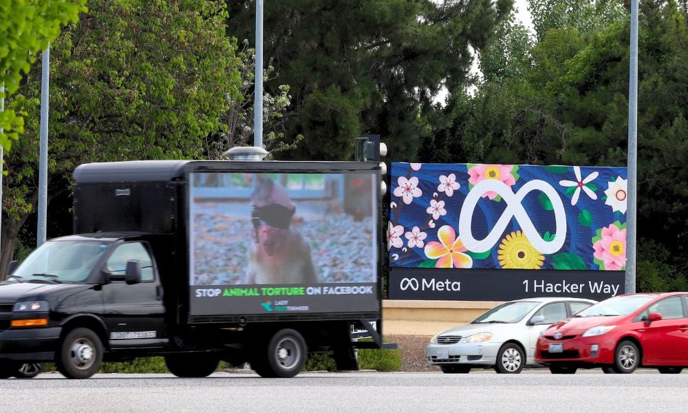 billboard video truck in front of Meta sign
