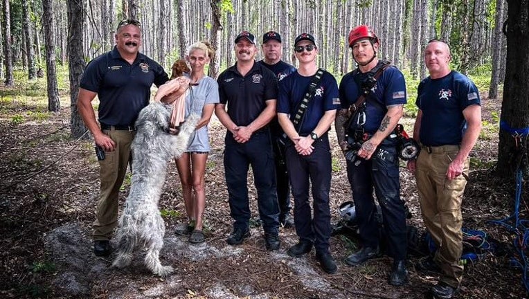 dog reunited with family and rescuers